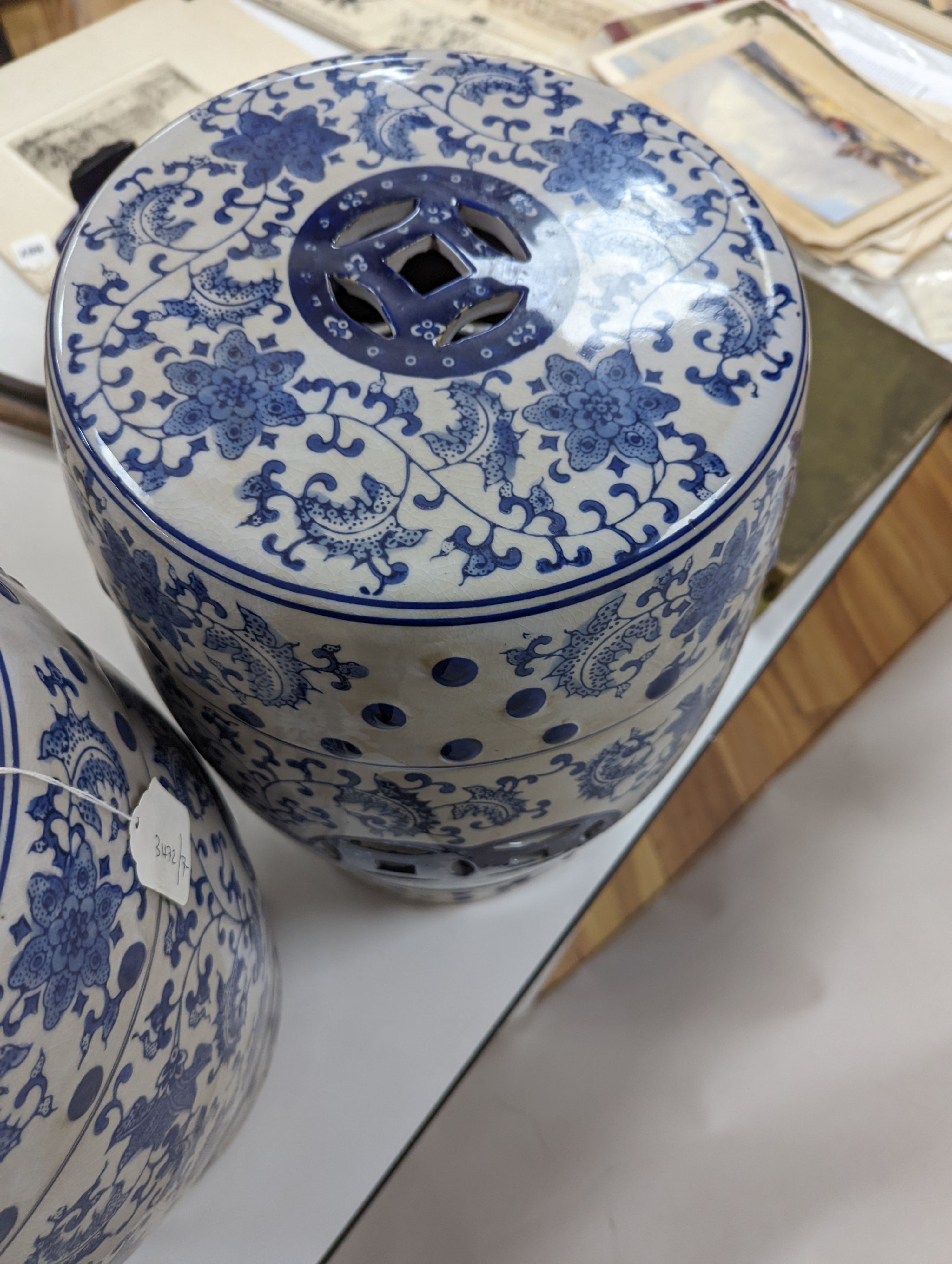 A pair of Chinese blue and white garden seats, 44 cms high.
